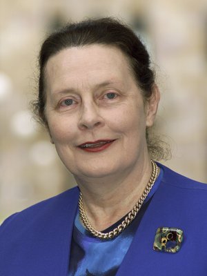 Emeritus Professor Dr Mary Mahoney AO. Head shot of a woman in a blue jacket